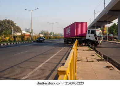 Faridabad, Haryana, India- April 9 2022: truck trailer lorry transport delivery container unit in accident on the roadside safety barriers, 