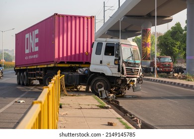 Faridabad, Haryana, India- April 9 2022: delivery container truck accident on the roadside safety barriers, 