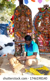 FARIDABAD, HARYANA / INDIA - FEBRUARY 2020 : Men At Work, Indian Male Artist Making Idol Of Indian God With Wood At Surajkund Craft Fair