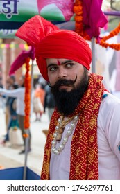 Faridabad, Haryana / India - February 2020 : Portrait Of Indian Male Artist In Traditional Dress And Colorful Turban Participating In Surajkund Fair