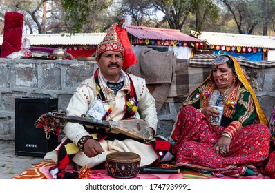 Faridabad, Haryana / India - February 2020 : Portrait Of Indian Couple Artist In Traditional Dress And Colorful Turban Participating In Surajkund Fair