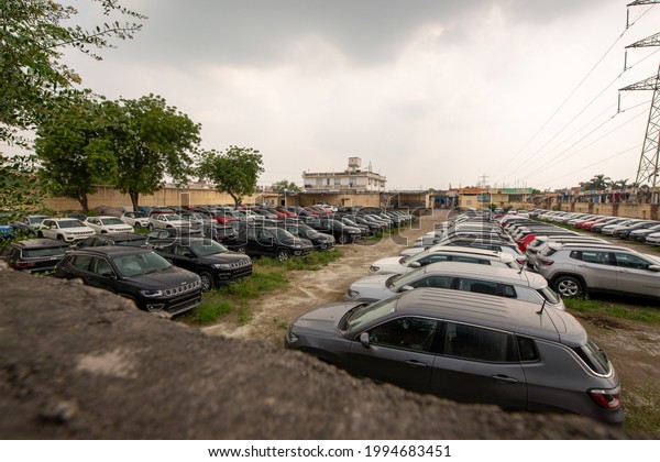 Faridabad, Haryana, India-23 August 2019:\
Jeep Compass Facelift cars and volkswagen polo car parked in large\
compound at faridabad,  dealer warehouse\
house