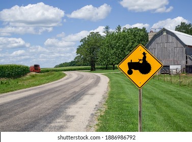 Farm Equipment Caution Sign:  A Sign In Southern Wisconsin Alerts Motorists To Watch For Farm Machinery On The Road Ahead.
