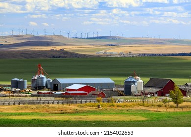 A farm and farmland agricultural landscape in the Canadian prairies near Lundbreck, Alberta, Canada. - Shutterstock ID 2154002653