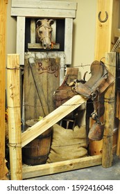 Farm Goods Display In A Country Store With Horse Stall, Saddles, Horseshoes And Burlap Feed Bags