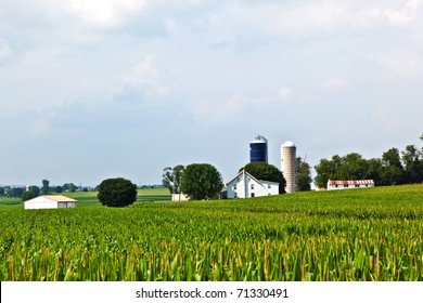 farm house with field and silo in beautiful landscape - Powered by Shutterstock