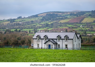 Farm House And Green Fields In Southern Ireland