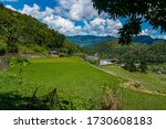 Farm houses in the Banaue rice terrace at hungduan rice terraces - ifugao with a look in the valley