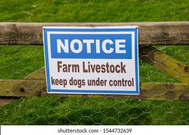 'Farm Livestock - Keep Dogs Under Control Sign On A Gate