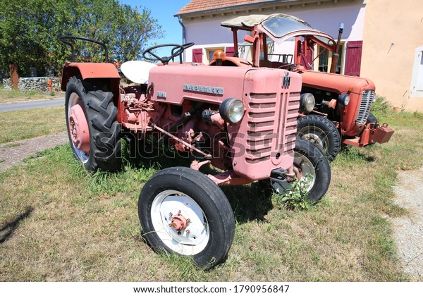 Farm market in Lunéville, France, vintage
tractor McCormick D226,
07-27-2020
