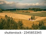 Farm on agricultural fields landscape. Farm house on agricultural field. Farmland fields landscape. Agriculture farm field landscape