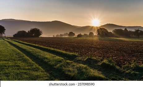 A Farm Road And The Rising Sun