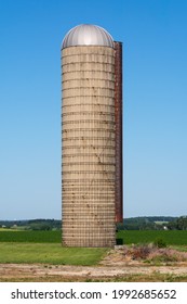 Farm silo in open field on a beautiful sunny morning.  Lee County, Illinois, USA