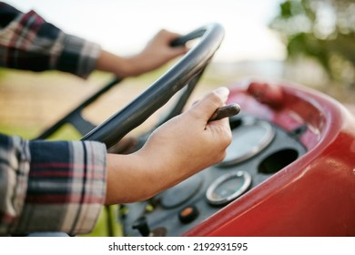 Farm, Tractor And Agriculture With Hands Of A Farmer Driving A Vehicle On A Farm For Sustainability, Growth And Development In A Sustainable And Green Environment. Farming Crops In The Harvest