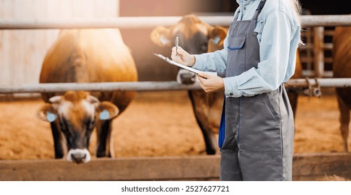 Farm worker use digital tablet for online inspection health of cow. Concept technologies of livestock industry, banner. - Powered by Shutterstock