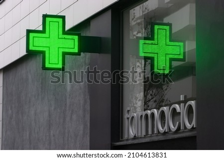 Farmacia-Pharmacy. Pharmacy symbol on facade
