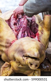 Farmer Carries Out A Slaughter Of Pig.