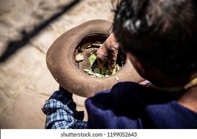 
Farmer With Coca Leaf In His Hat In A Village In Peru