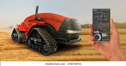 A farmer controls an autonomous tractor through a smartphone mobile application