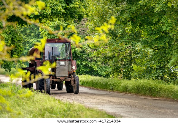 Farmer drives tractor on
road!