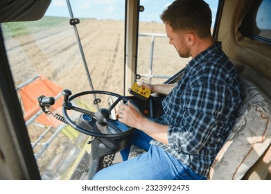 Farmer driving combine and harvesting crop - Powered by Shutterstock