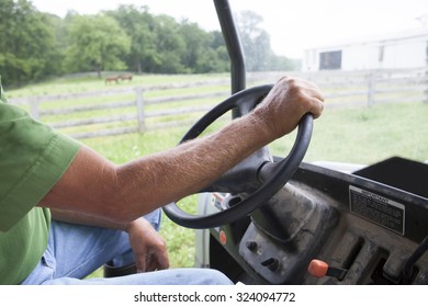 Farmer Driving Tractor