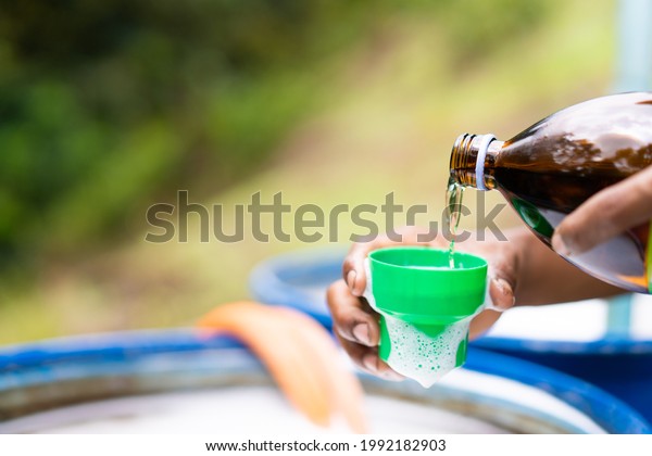 Farmer Hand Pouring Chemical Insecticide Liquid Stock Photo 1992182903 ...