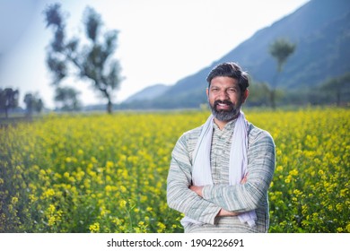 Farmer in oilseed rape agricultural field