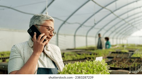 Farmer, phone call and greenhouse plants, agriculture or farming communication, growth and agro business management. Senior woman, supplier or seller talking on mobile with sprout tray or gardening - Powered by Shutterstock