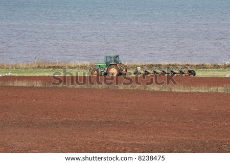 Similar – Image, Stock Photo Tractor plowing field