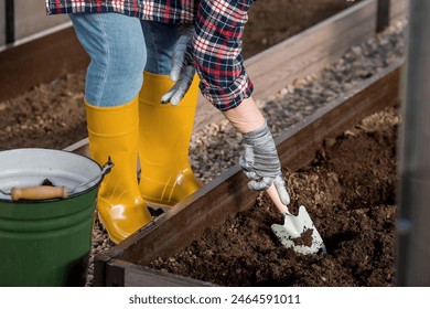 The farmer pourvu new soil, soil for a new greenhouse. The concept of spring planting of vegetables and farming. - Powered by Shutterstock