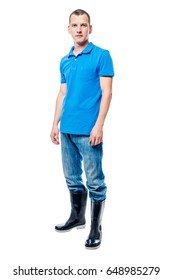 Farmer In Rubber Boots And Jeans In Full Length On A White Background