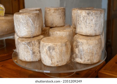 Farmer shop in La Grave ski village, Hautes Alpes, France, cheese for sale, Tomme from Sheep milk, farmers cheese, close-up