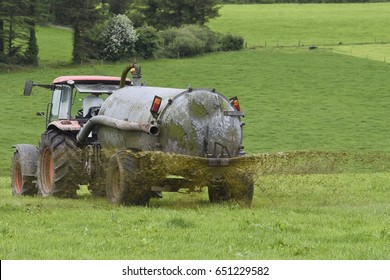 Farmer Spreading Slurry In Field