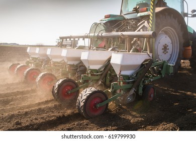 Farmer With Tractor Seeding - Sowing Soy Crops At Agricultural Fields In Spring