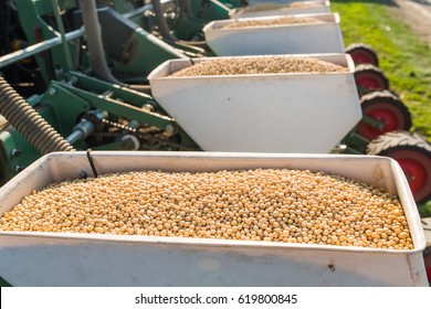 Farmer With Tractor Seeding - Sowing Soy Crops At Agricultural Fields In Spring