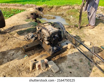 A Farmer Using Diesel Water Pump To Suck Ground Water For Fields.