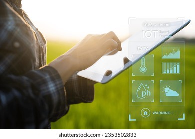 Farmer using iot digital tablet computer and modern interface icons, Business agriculture technology concept.