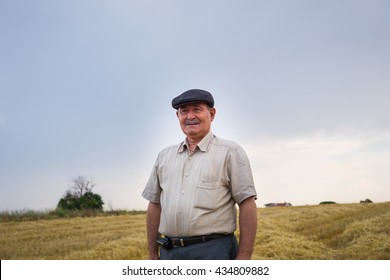 Farmer is waiting in the middle of the field - Powered by Shutterstock