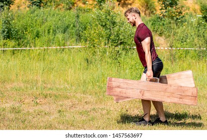 Farmer Walk During Obstacle Race Training In The Boot Camp