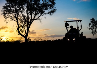 Farmer Working Into The Night