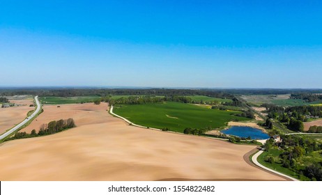 Farmers field. Green farmers field.
				shot from above, from drone. Field and forest. Beautiful top view of plowed and sown fields. Aerial panorama drone view of typical agricultural landscape.
