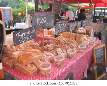 Farmer's market: Freshly baked bread at local farmer's market. South African traditional farmer's market stall with fresh local organic bread. Currency: South African Rand (ZAR). Buying local. - Powered by Shutterstock