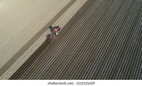 Farmers Use Planters To Plant Plastic Coated Peanuts On Farms, North China