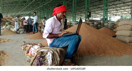 Farmers Using Laptop Seating At Sack Roll At Agriculture Produce Market District Katni Madhya Pradesh In India Shot Captured On Aug 2019