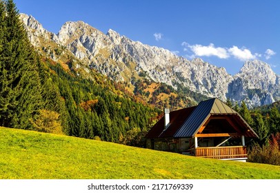 Farmhouse in the mountains. Mountain house in mountainside terrain. Mountain home. Farm in mountains