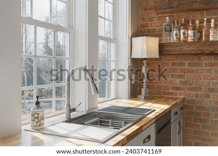 Farmhouse Rustic Kitchen Corner with Brick Wall Accent and Natural Light Pouring Over Wooden Countertop and Farmhouse Sink