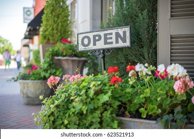 Farmhouse Style Open Sign Outside Of A Small Town Business  