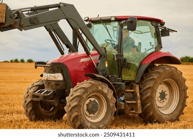 Farming, man and tractor in land for care, ground maintenance and hay in countryside. Person, harvest machine and driving on California field for gathering, animal feed and agriculture in USA - Powered by Shutterstock