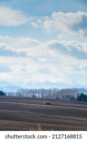 Farming In Spring Fields And Tractors
